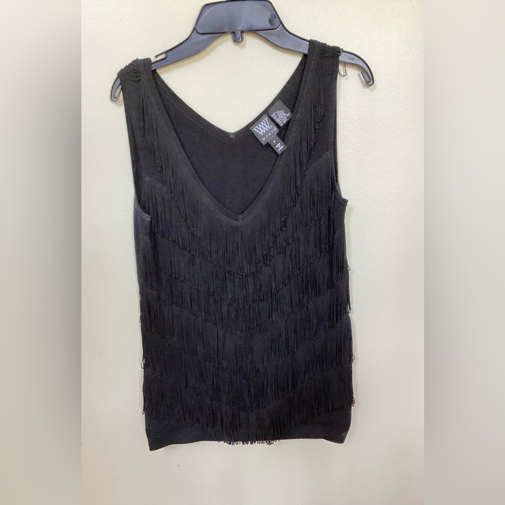 Worth topwith layers of fringe.